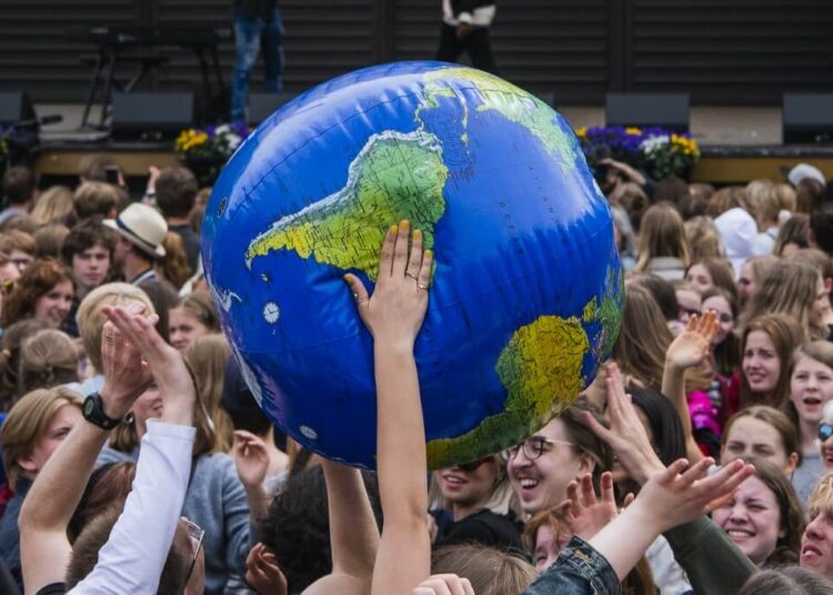 Protesters throw an earth-shaped ball during the "Global Strike For Future" demonstration in Stockholm on May 24, 2019, a global day of student protests aiming to spark world leaders into action on climate change. - In a shift since the last European Parliament elections, mainstream parties have adopted climate change as a rallying cry -- spurred in part by a wave of student strikes. A Eurobarometer poll shows climate change is now a leading concern for European Union voters, not far behind economic issues and rivalling worries about migration. (Photo by Jonathan NACKSTRAND / AFP)