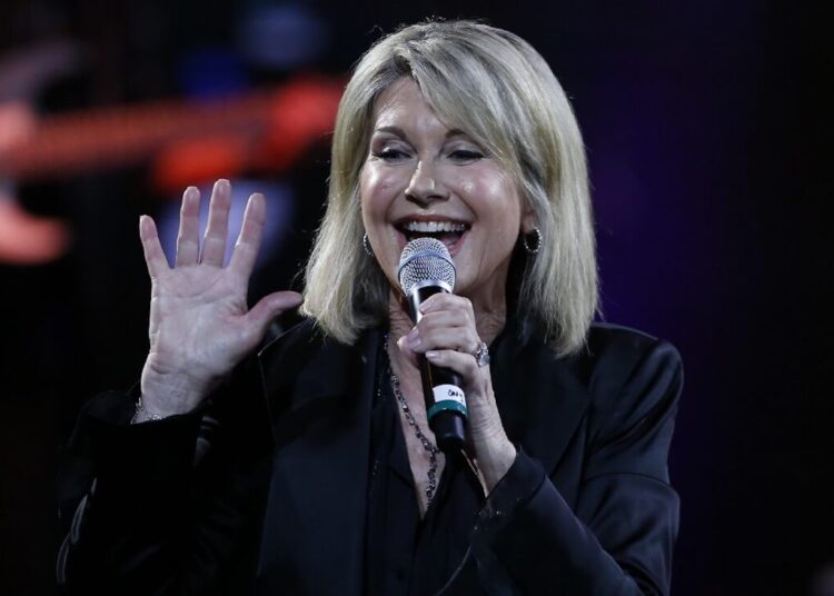 (FILES) In this file photo taken on February 23, 2017 British-Australian singer Olivia Newton-John performs at the 58th Vina del Mar International Song Festival on February 23, 2017 in Vina del Mar, Chile. - British-born Australian singer Olivia Newton-John is made a Dame Commander of the Order of the British Empire (DBE) for services to charity, cancer research and entertainment in the 2020 New Years Honours list. (Photo by PAUL PLAZA / AFP)