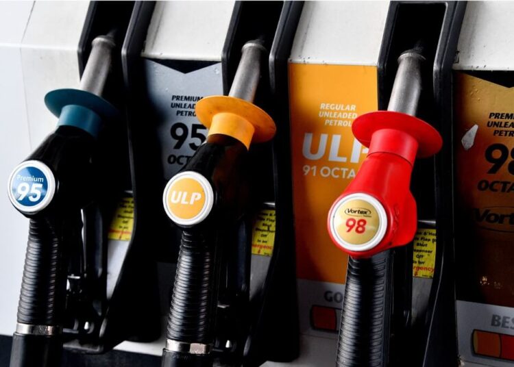 Nozzles labeled with different types of fuel are seen at a filling station in Sydney on April 22, 2020. - Oil resumed its painful retreat on April 22, extending a rout that has torn through energy markets, though stock exchanges in Asia and Europe were mixed following a two-day sell-off. (Photo by Saeed KHAN / AFP)