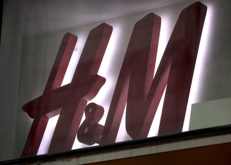 CHICAGO, ILLINOIS - DECEMBER 16: A sign hangs above the front entrance of an H&M store on the Magnificent Mile on December 16, 2019 in Chicago, Illinois. Stock in the fashion retailer climbed today after the company reported its sales rose 9% in the fourth quarter.   Scott Olson/Getty Images/AFP