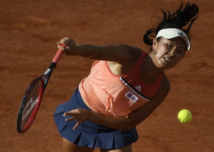 China's Peng Shuai serves to France's Caroline Garcia during their women's singles second round match on day five of The Roland Garros 2018 French Open tennis tournament in Paris on May 31, 2018. (Photo by Eric Feferberg / AFP)