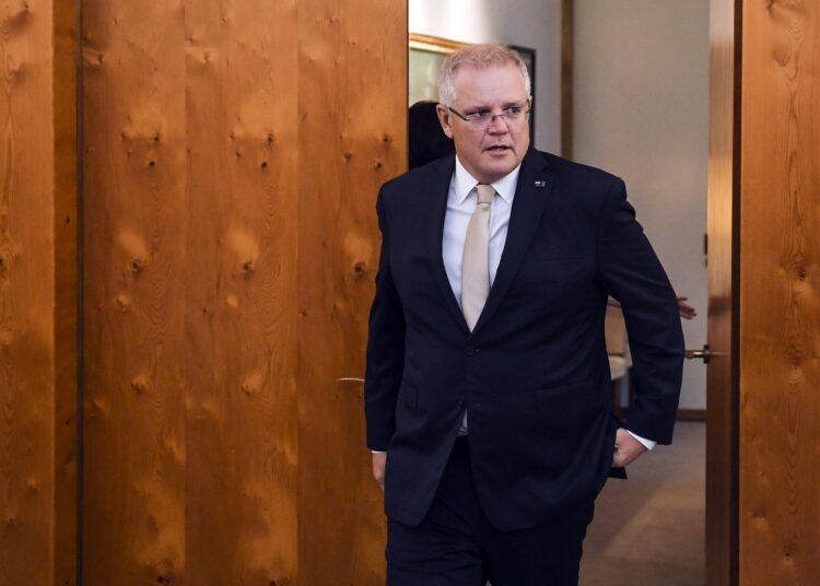 Australian Prime Minister Scott Morrison arrives to welcome Indonesian President Joko Widodo ahead of signing the official visitors book at Parliament House in Canberra on February 10, 2020. - Australia and Indonesia on February 10 announced a 100-day "action plan" to implement a long-awaited trade deal, a decade after negotiations began on the multi-billion-dollar agreement. (Photo by LUKAS COCH / POOL / AFP)