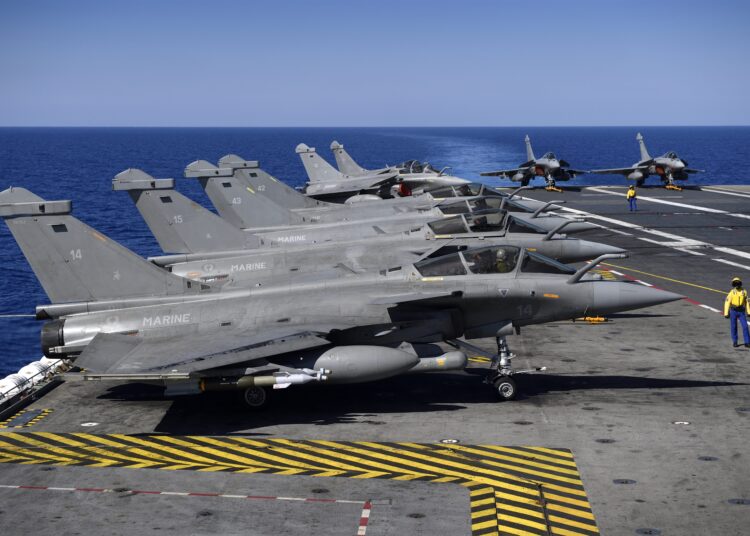 (FILES) This file photo taken on October 1, 2016 shows Marine Rafale fighter jets before taking off on the deck of the French aircraft carrier Charles de Gaulle on the Mediterranean Sea, as part of the Operation Arromanches III. - France has agreed to sell 30 more Rafale fighter jets to Egypt, a source close to the contract said on May 3, 2021, confirming an online report of a secret mega-defence deal. (Photo by Eric Feferberg / AFP)