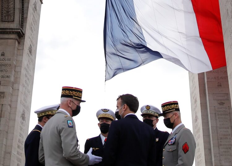 French President Emmanuel Macron and the heads of the army corps  attend a ceremony marking the 76th anniversary of Victory in Europe (VE-Day), marking the end of World War II in Europe, in Paris on May 8, 2021. - The leader of the Free French Forces, Charles de Gaulle, announced the official end of World War II to the French people on May 8, 1945, marking the end of a six-year war and the Nazi oppression in France, which resulted in millions of deaths. (Photo by CHRISTIAN HARTMANN / POOL / AFP)