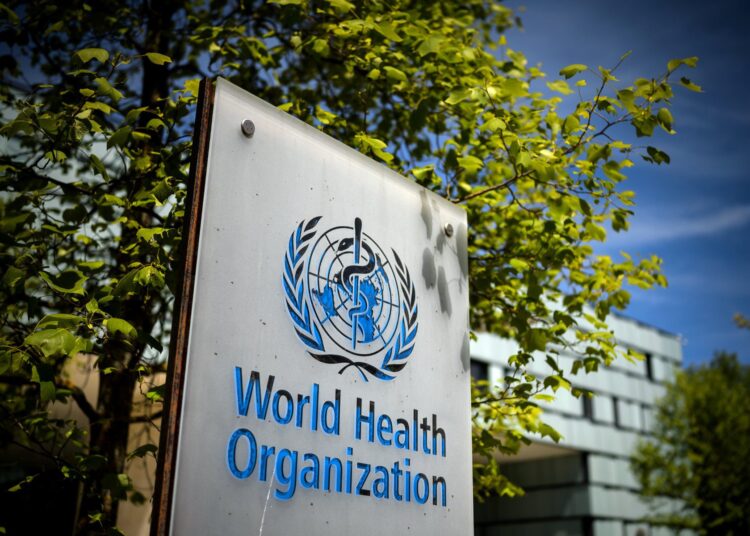 A picture taken on May 8, 2021 shows a sign of the World Health Organization (WHO) at the entrance of their headquarters in Geneva amid the Covid-19 coronavirus outbreak. (Photo by Fabrice COFFRINI / AFP)