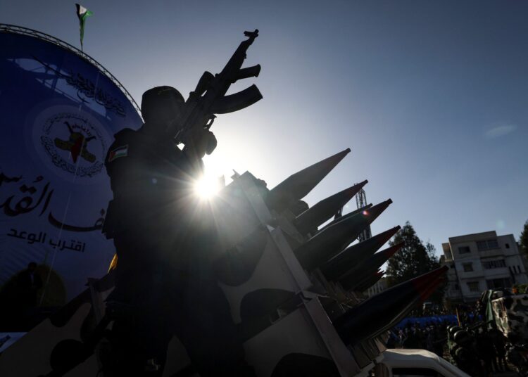 Fighters with the Saraya al-Quds Brigades, the armed wing of the Palestinian Islamic Jihad movement, parade with their weapons in the streets of Gaza City during a rally, on May 29, 2021, more than a week after a ceasefire brought an end to 11 days of hostilities between Israel and Hamas. (Photo by Mahmud Hams / AFP)
