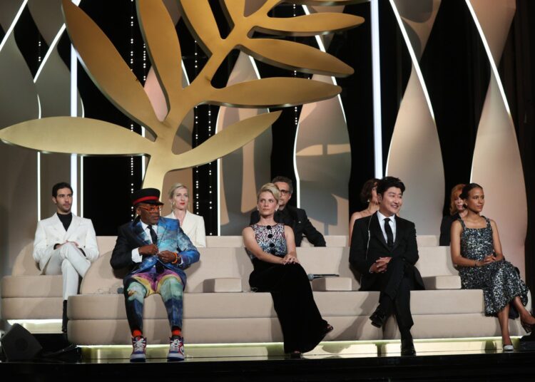 (Front L to R) US director and Jury President of the 74th Cannes Film Festival Spike Lee, and jury members, French actress and director Melanie Laurent, South Korean actor Song Kang-Ho, French-Senegalese director Mati Diop and (back L to R) French actor Tahar Rahim, Austrian director Jessica Hausner, Brazilian director Kleber Mendonca Filho, US actress Maggie Gyllenhaal and French-Canadian singer Mylene Farmer attend the closing ceremony of the 74th edition of the Cannes Film Festival in Cannes, southern France, on July 17, 2021. (Photo by Valery HACHE / AFP)