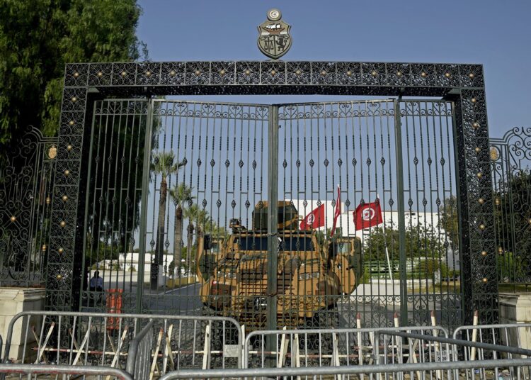 (FILES) A file photo taken on July 26, 2021 shows Tunisian army barricading the parliament building in the capital Tunis, after the president dismissed the prime minister and ordered parliament closed for 30 days. (Photo by Yassine MAHJOUB / AFP)