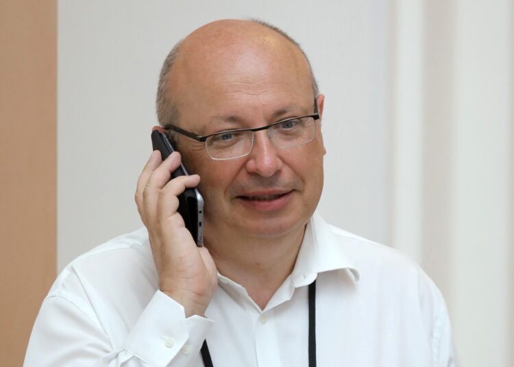 (FILES) In this file photo taken on August 25, 2019 French Ambassador in charge of the G7 summit preparations Jean-Pierre Thebault speaks on his mobile phone while working in Biarritz, south-west France, on the second day of the annual G7 Summit. - France on September 17, 2021 recalled its ambassadors to the United States, Philippe Etienne, and Australia, Jean-Pierre Thebault, for consultations in a ferocious row over the scrapping of a submarine contract, an unprecedented step that revealed the extent of French anger against its allies. (Photo by Ludovic MARIN / AFP)