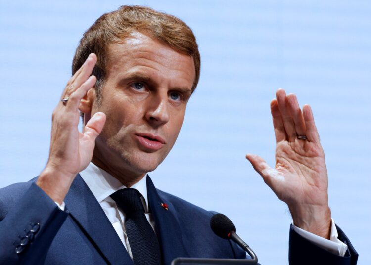 France's President Emmanuel Macron gestures as he addresses media representatives at a press conference in Rome on October 31, 2021, during the G20 Summit. (Photo by Ludovic MARIN / AFP)