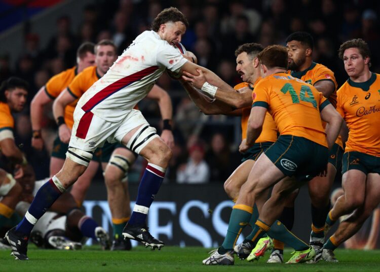 England's lock Jonny Hill (centre left) is tackled during the Autumn International friendly rugby union match between England and Australia at Twickenham Stadium, west London, on November 13, 2021. (Photo by Adrian DENNIS / AFP)
