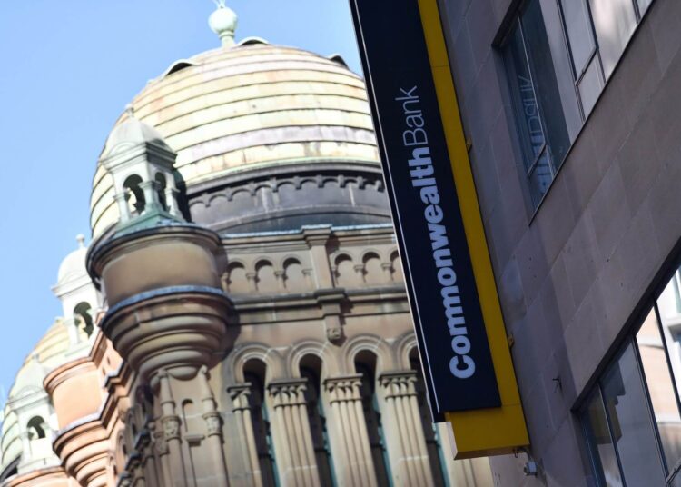 FILES-- This file photo taken on May 1, 2018 shows a signage for Australia's biggest company, the Commonwealth Bank, is seen on a building in Sydney. - Australia's troubled Commonwealth Bank admitted on May 3, 2018 it has lost financial records for almost 20 million customers in a major security blunder, but insisted there was no need to worry. (Photo by SAEED KHAN / AFP)