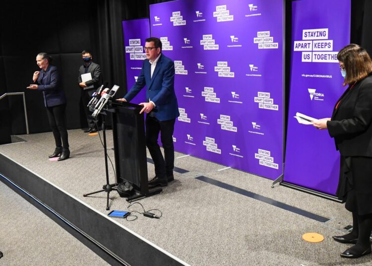 Victoria's state premier Daniel Andrews (C) speaks during a press conference in Melbourne on August 5, 2020. - Australia's worst-hit state of Victoria reported 15 coronavirus deaths on August 5, including a man in his 30s, making it the country's deadliest day of the pandemic to date. (Photo by William WEST / AFP)