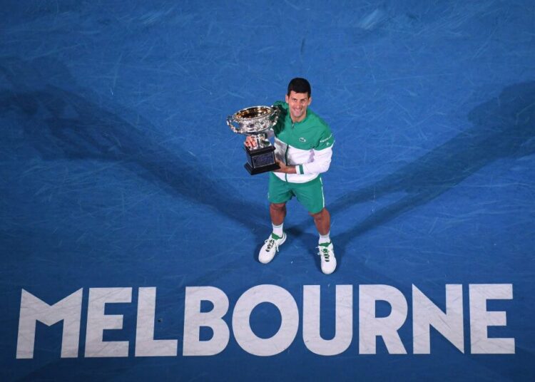 6468883 21.02.2021 In this handout photo released by Tennis Australia, first-placed Serbia's Novak Djokovic poses during an awarding ceremony after the singles final tennis match against Russia's Daniil Medvedev at the Australian Open 2021 tennis championship in Melbourne, Australia. Editorial use only, no archive, no commercial use. MORGAN HANCOCK / Tennis Australia (Photo by MORGAN HANCOCK / Tennis Australia / Sputnik via AFP)