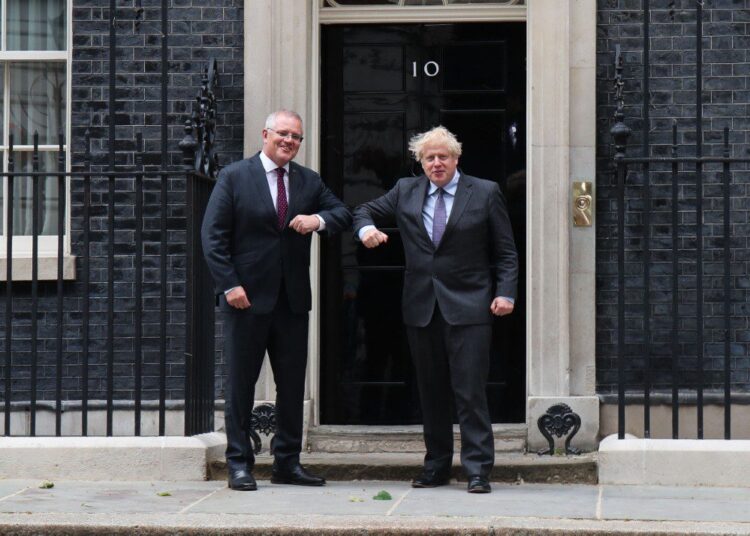 British Prime Minister Boris Johnson greets Australian Prime Minister Scott Morrison outside the door of 10 Downing Street, London, UK on 14th June 2021. (Photo by Lucy North/MI News/NurPhoto) (Photo by MI News / NurPhoto / NurPhoto via AFP)