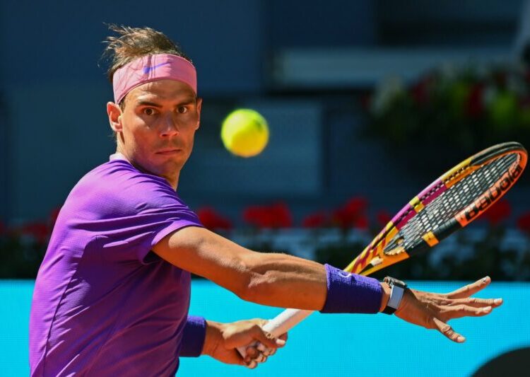 Spain's Rafael Nadal eyes the ball during his 2021 ATP Tour Madrid Open tennis tournament singles match against Australia's Alexei Popyrin at the Caja Magica in Madrid on May 6, 2021. (Photo by GABRIEL BOUYS / AFP)