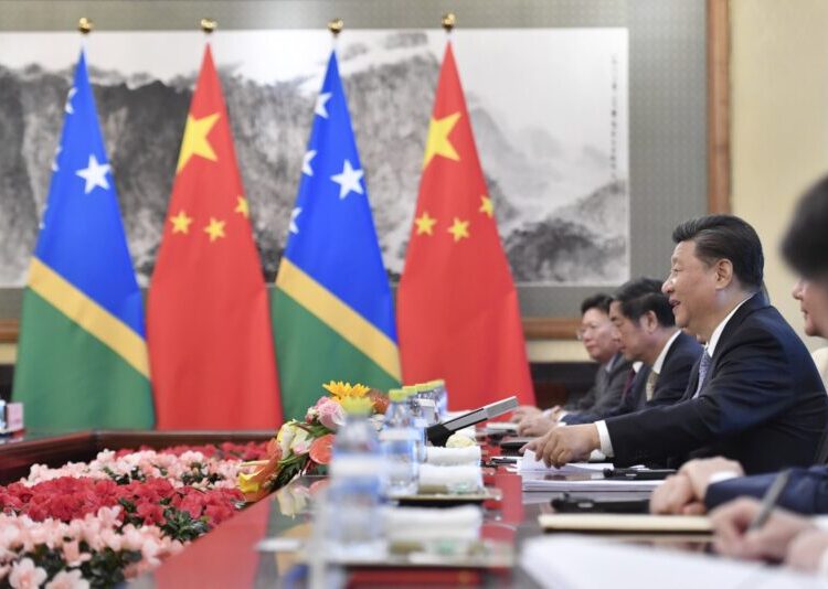 Chinese President Xi Jinping talks to Solomon Islands Prime Minister Manasseh Sogavare (not pictured) during their meeting at the Diaoyutai State Guesthouse in Beijing on October 9, 2019. (Photo by Parker Song / POOL / AFP)