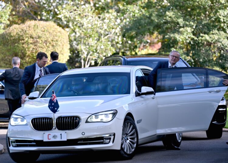 Australia's new Prime Minister Anthony Albanese gets into a vehicle as he leaves Government House after a swearing-in ceremony in Canberra on May 23, 2022. (Photo by SAEED KHAN / AFP)