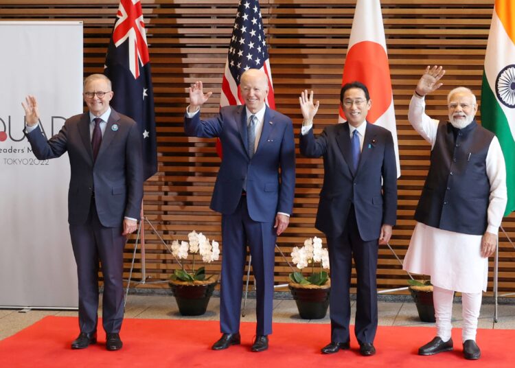 (L-R) Australian Prime Minister Anthony Albanese, US President Joe Biden, Japanese Prime Minister Fumio Kishida, and Indian Prime Minister Narendra Modi wave to the media prior to the Quad meeting at the Kishida's office in Tokyo on May 24, 2022. (Photo by STR / AFP)