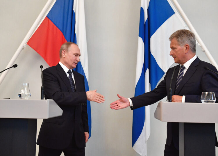 (FILES) This file photo taken on July 27, 2017 shows Finland's President Sauli Niinisto (R) and Russian President Vladimir Putin shaking hands after a press conference in Punkaharju hotel in Savonlinna, Finland. - Finnish President Sauli Niinisto spoke with his Russian counterpart Vladimir Putin on May 14, 2022 regarding the Nordic country's application for NATO membership, which is expected to be officially announced this weekend, his office said. (Photo by Alexander NEMENOV / AFP)