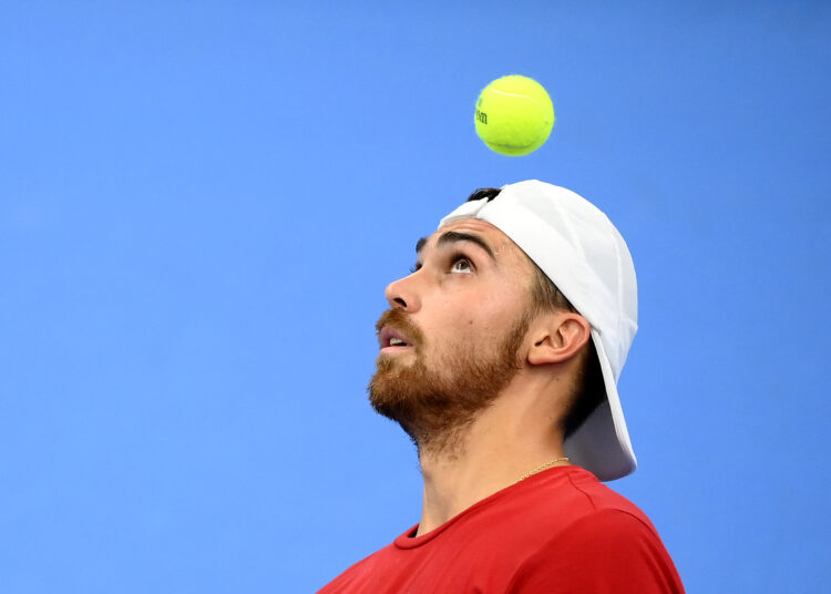 France's Benjamin Bonzi eyes the ball during a training session prior to the upcoming Davis Cup tournament in Germany, on September 9, 2022, in Paris. - The French Davis Cup team will play the group phase from September 14 to 18 in Hamburg. (Photo by FRANCK FIFE / AFP)