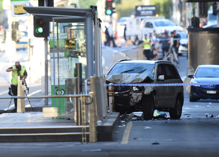 Police and Emergency workers at the scene of where a car ran over pedestrians in Flinders street in Melbourne, December 21, 2017. Mal Fairclough / AFP