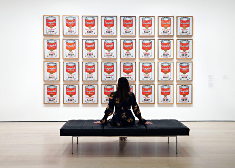 NEW YORK, NEW YORK - NOVEMBER 13: Andy Warhol's 'Campbell's Soup Cans' is on display during a press preview of MoMAs first ever Fall Reveal at Museum of Modern Art on November 13, 2020 in New York City.   Cindy Ord/Getty Images/AFP (Photo by Cindy Ord / GETTY IMAGES NORTH AMERICA / AFP)
