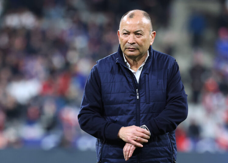 (FILES) In this file photo taken on March 19, 2022 England's head coach Eddie Jones looks on during warm up prior to the  Six Nations rugby union tournament match between France and England at the Stade de France in Saint-Denis, outside Paris. - Eddie Jones was dismissed as England rugby coach, England's Rugby Football Union (RFU) said in a statement on December 6, 2022. (Photo by Thomas SAMSON / AFP)