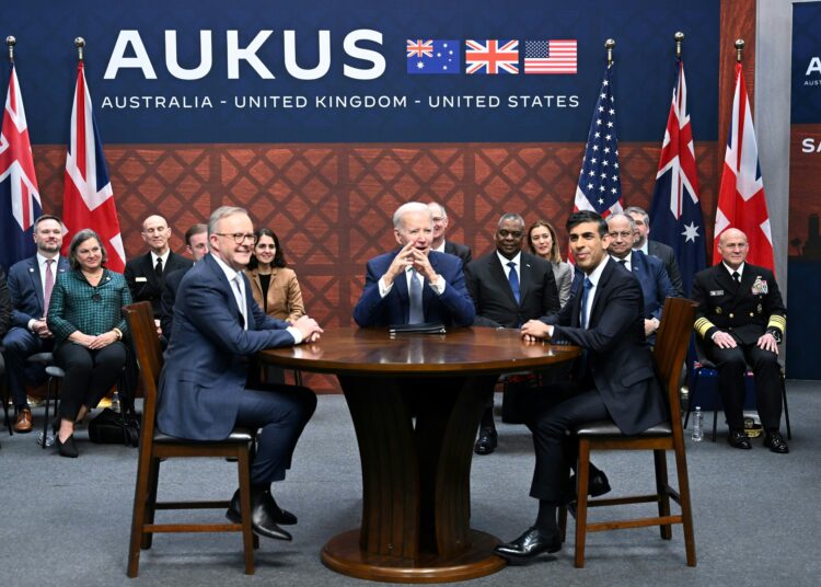 US President Joe Biden (C) participates in a trilateral meeting with British Prime Minister Rishi Sunak (R) and Australia's Prime Minister Anthony Albanese (L) during the AUKUS summit on March 13, 2023, at Naval Base Point Loma in San Diego California. - AUKUS is a trilateral security pact announced on September 15, 2021, for the Indo-Pacific region. (Photo by Jim WATSON / AFP)