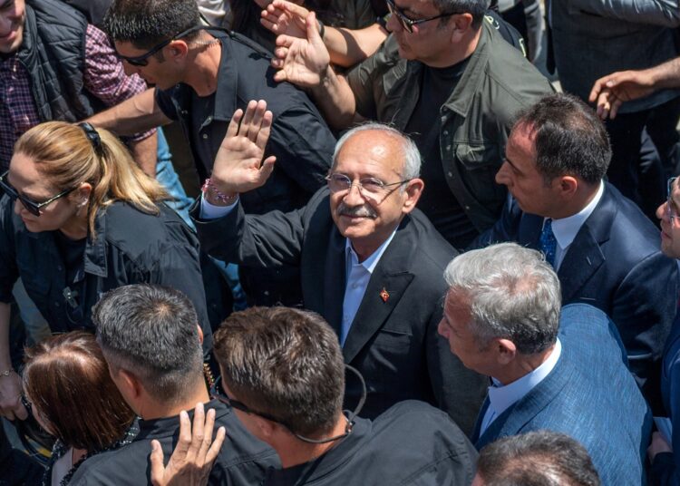 Turkey's Republican People's Party (CHP) Chairman and Presidential candidate Kemal Kilicdaroglu waves as he leaves after voting in the presidential and parliamentary elections, in Ankara, Turkey, on May 14, 2023. - Opposition leader Kemal Kilicdaroglu has portrayed his six-party alliance, which includes liberals, nationalists and religious conservatives, as a force for democratic change. The 74-year-old former civil servant has pledged to "bring democracy to this country by changing the one-man regime". (Photo by BULENT KILIC / AFP)