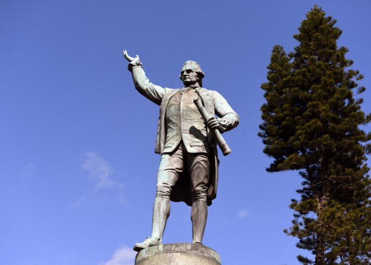 A statue of Captain James Cook stands in Sydney's Hyde Park on August 25, 2017, as Prime Minister Malcolm Turnbull  labelled calls to change colonial-era monuments and the date of Australia Day, in attempts to better reflect the country's indigenous past, as a 'Stalinist' excercise in re-writing history. A cultural debate intensified this week when prominent indigenous commentator Stan Grant dubbed the inscription "Discovered this territory 1770", on a Sydney statue of 18th century British explorer Capitan James Cook, a "damaging myth". (Photo by WILLIAM WEST / AFP)